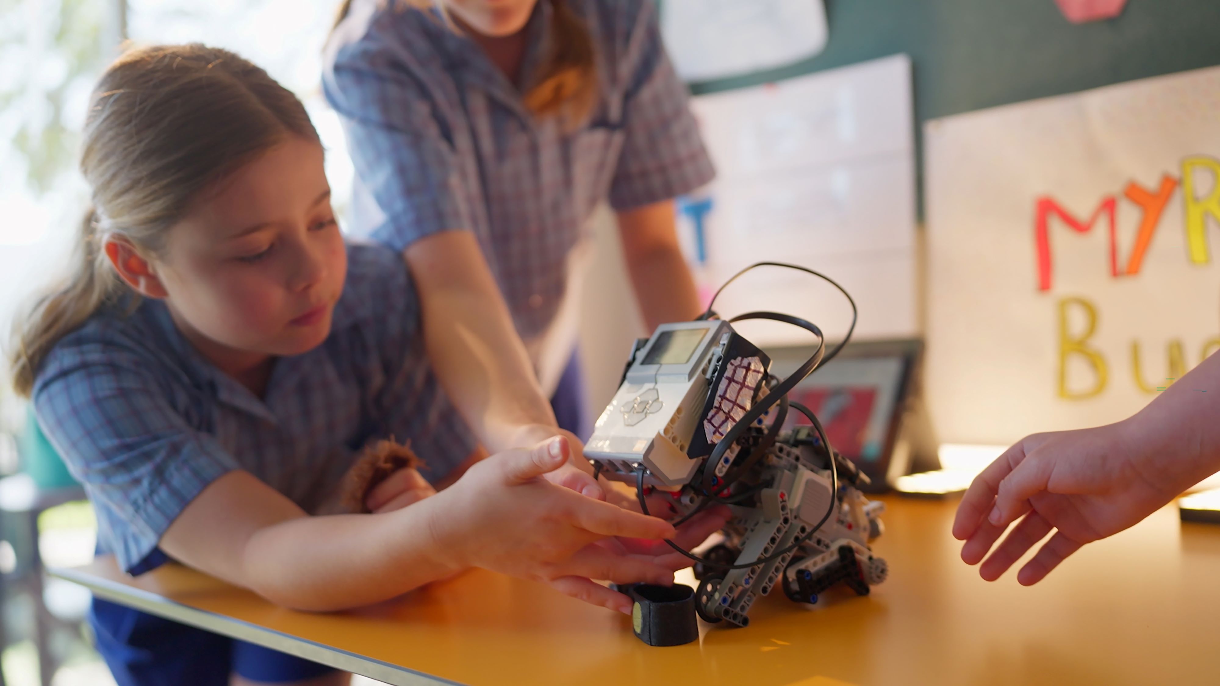 Students collaborating on a robotics project in the classroom, highlighting hands‑on STEM learning and problem solving
