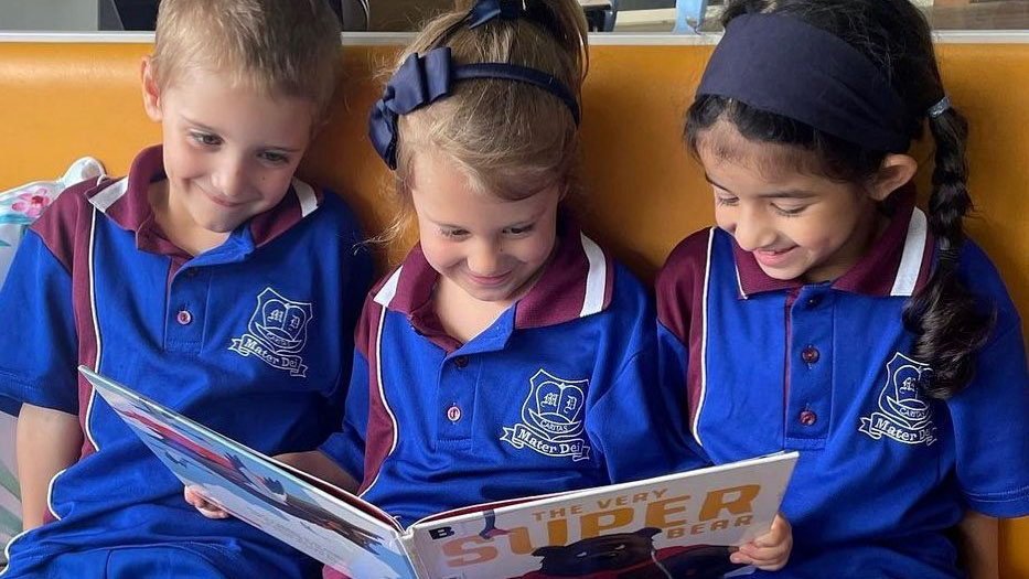 Students reading together, supporting shared literacy learning and engagement with reading